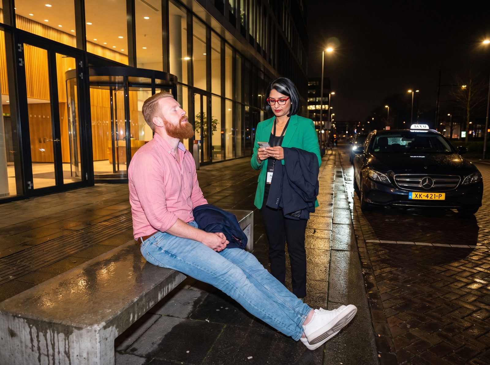 Daan resting on a bench outside while Priya holds his jacket; a taxi with a visible licence plate waits.